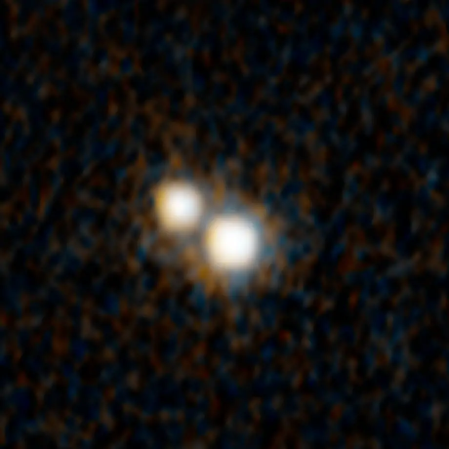 dual-quasar-j07492255 Фотография пары квазаров, сделанная космическим телескопом Хаббл